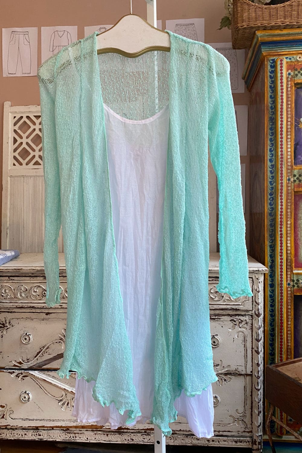 Mint colored long sleeve knit duster.