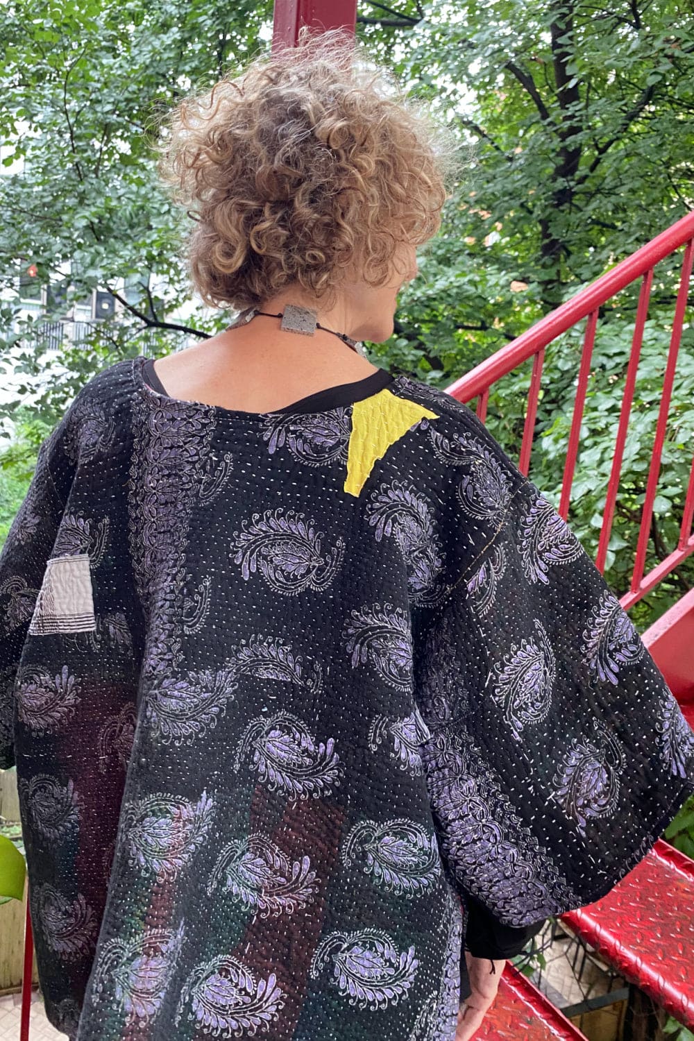 Back view of Black Kantha Pullover with lavender print and patchwork.