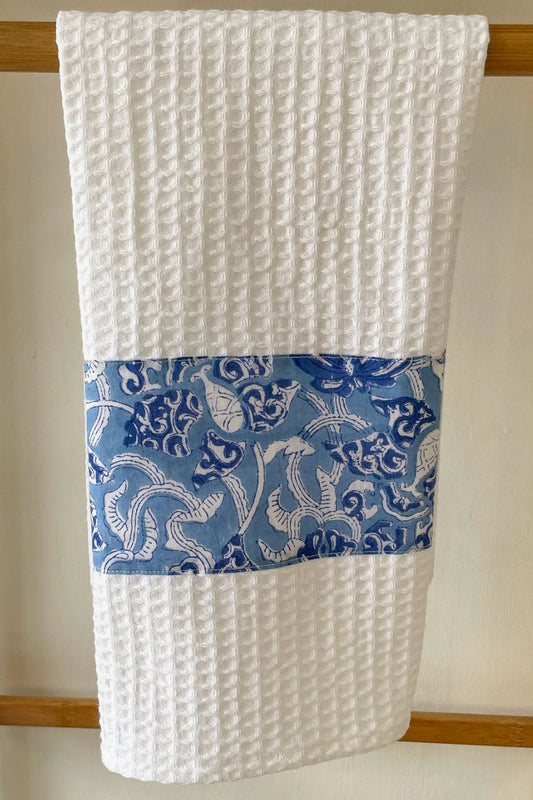 White cotton tea towel  decorated with blue handblocked  pattern.