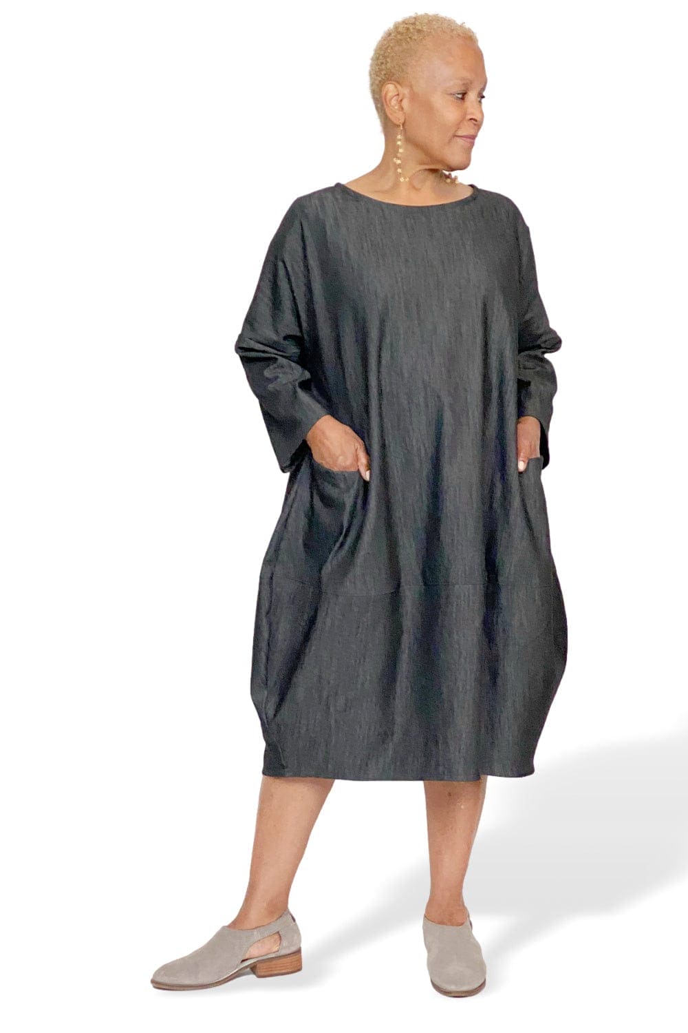 Loose fit dress with two front pockets and long sleeves worn on a 5'3" older woman.