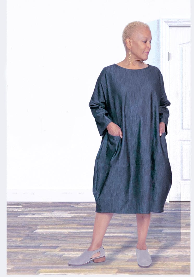 Cotton Denim Bubble Dress with two front pockets worn loose on an older woman.