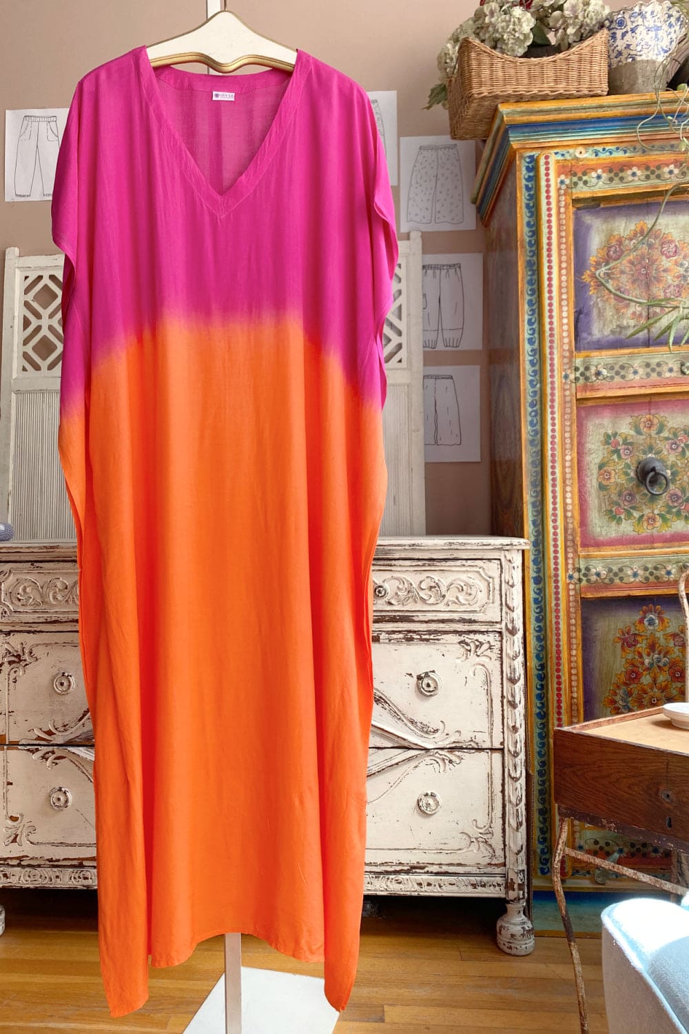 Pink and orange ombred women's caftan with a v neckline.