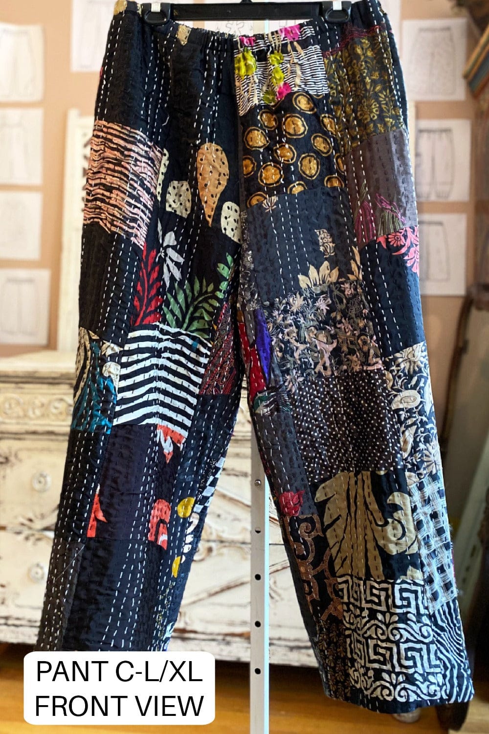 Fun patchwork kantha pants with lots of prints and colors on a black background.