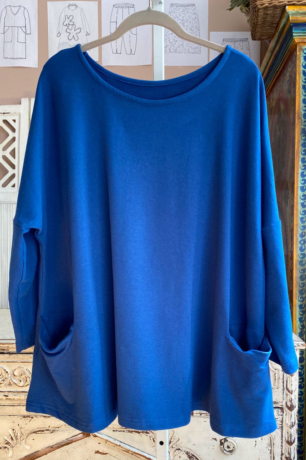 Lapus blue swing top with long sleeves.