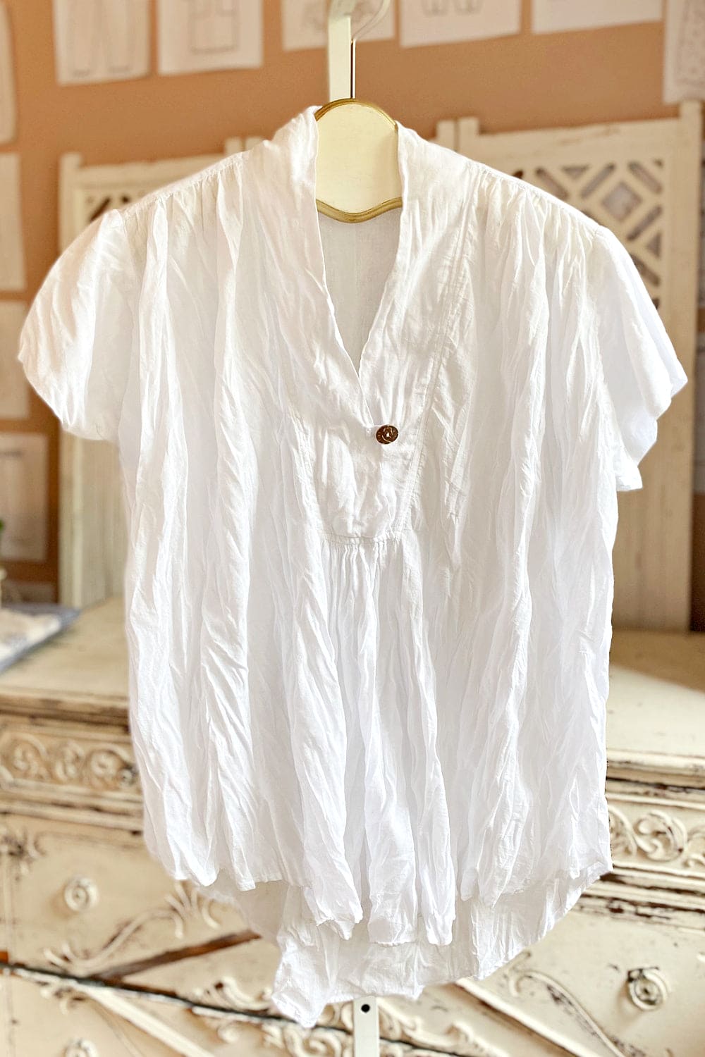 White v neck short sleeve cotton women's top.
