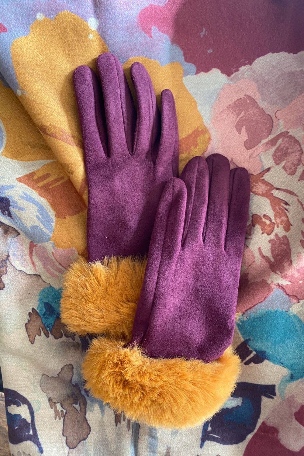 Purple gloves with mustard faux fur trim paired with matching scarf.