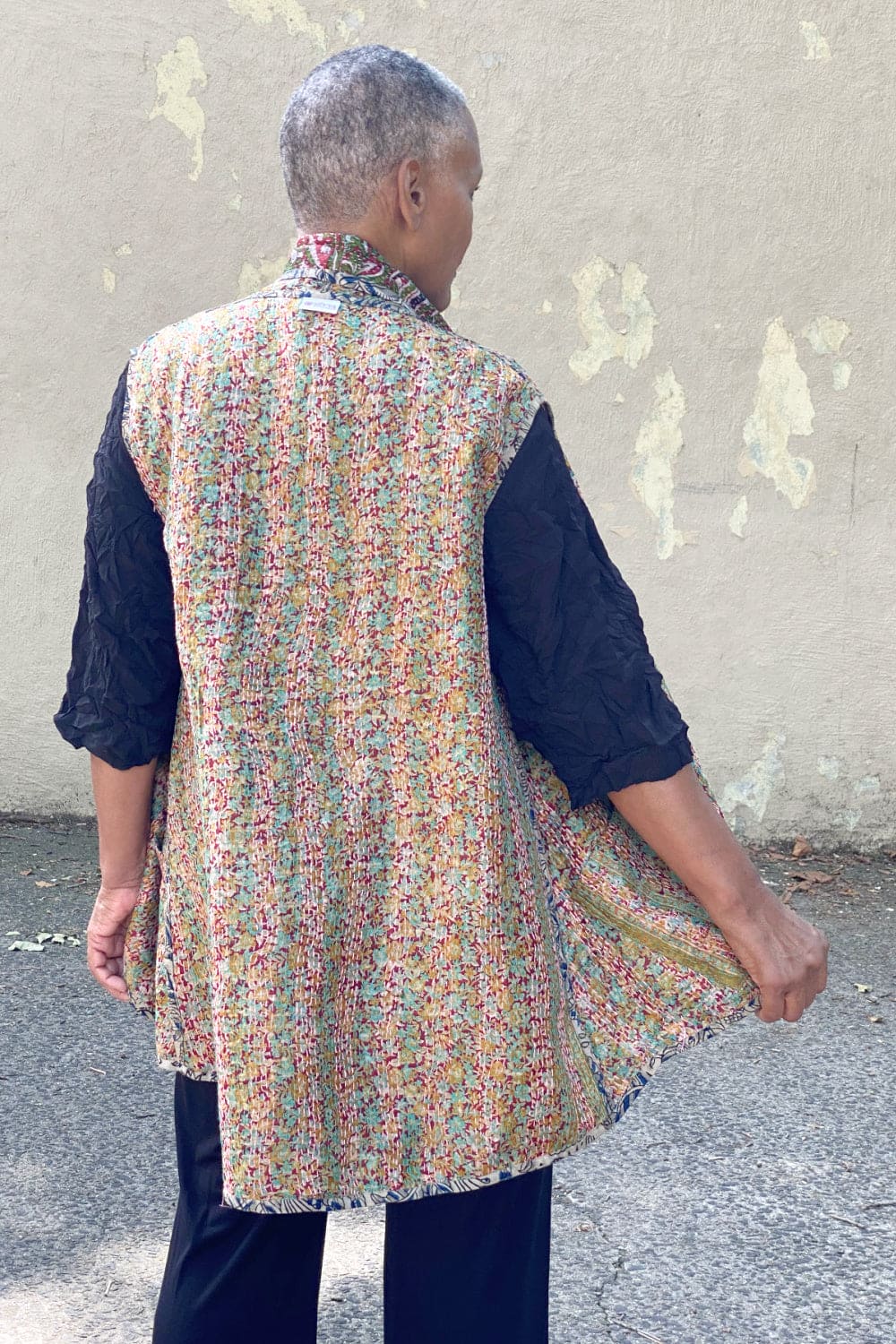 Back view of Reversible silk vest with Kantha stitching.