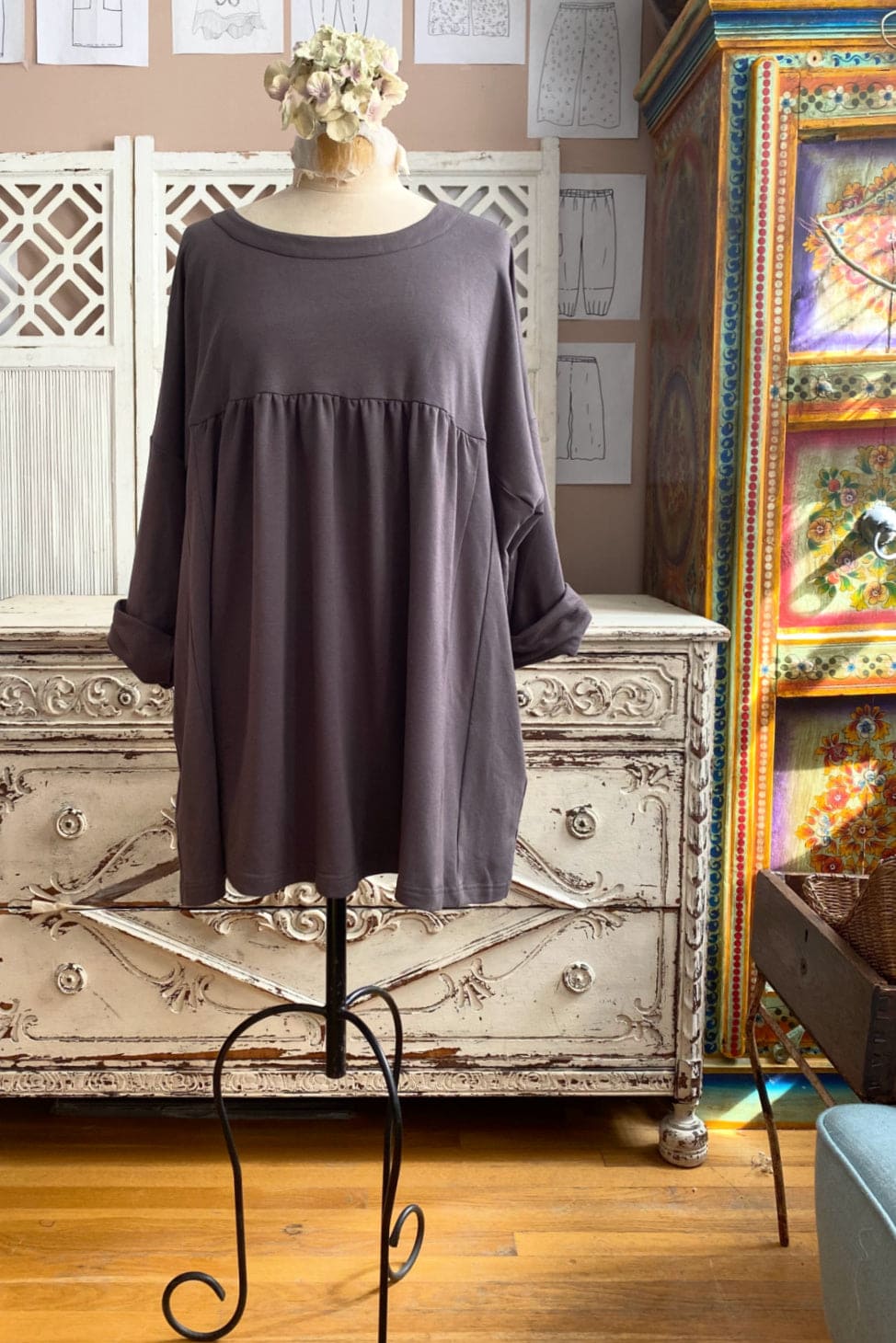 Cay color bamboo tunic displayed on a vintage dress form.