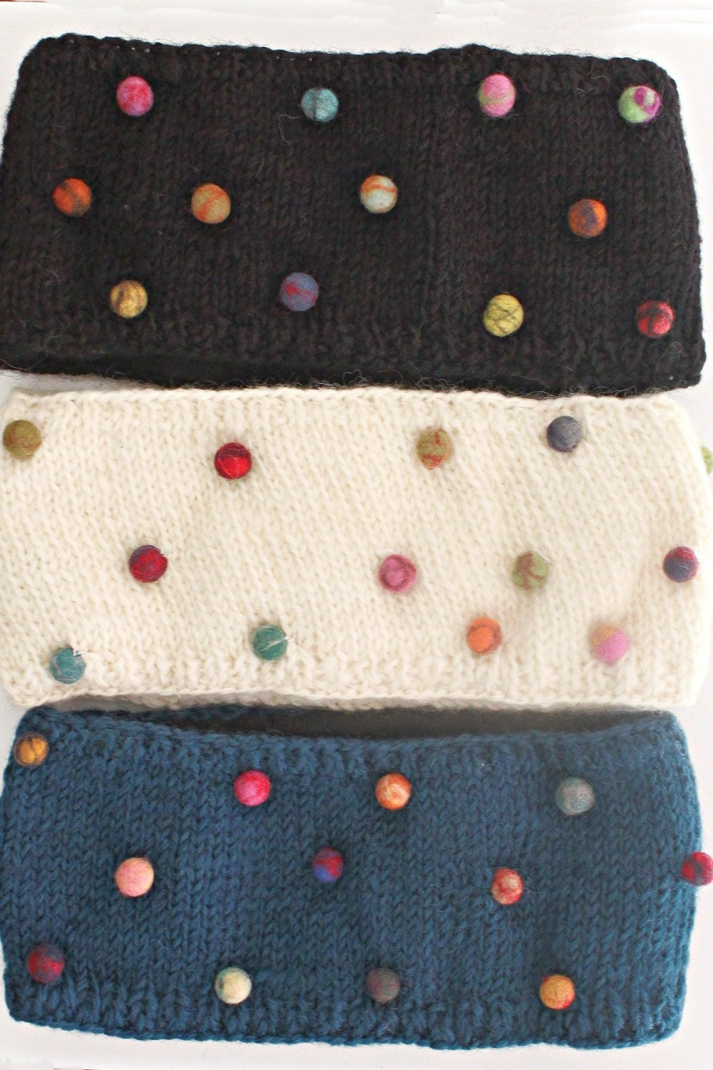  Wool Headbands in creme, black and blue. They are decorated with multi colored  Felt Dots